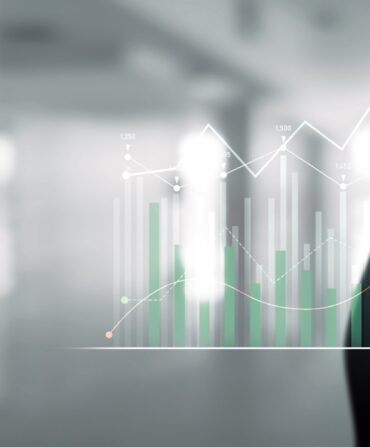 Businessman analyst working with digital finance business data graph showing technology of investment strategy for perceptive financial business decision. Digital economic analysis technology concept.