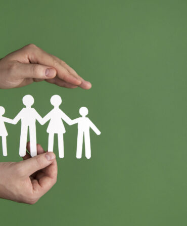 hand-holding-paper-people-close-up